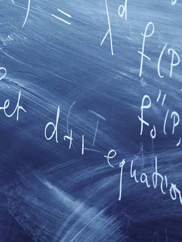 Calculations on a black board.