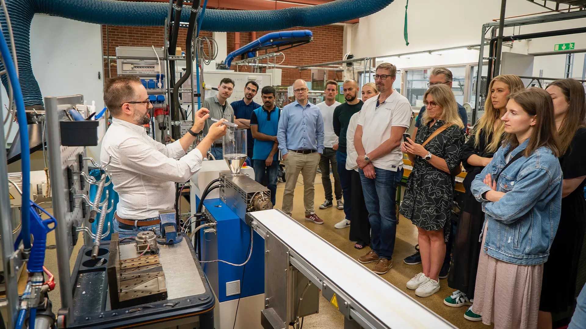 Professor Roland Kádár showing the new equipment to Wellspect employees.