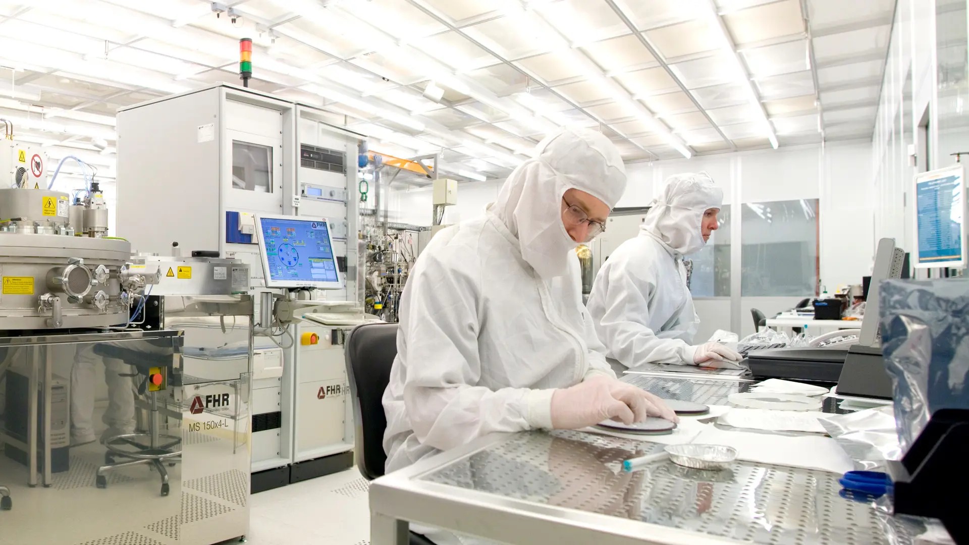 Researchers inside the cleanroom.