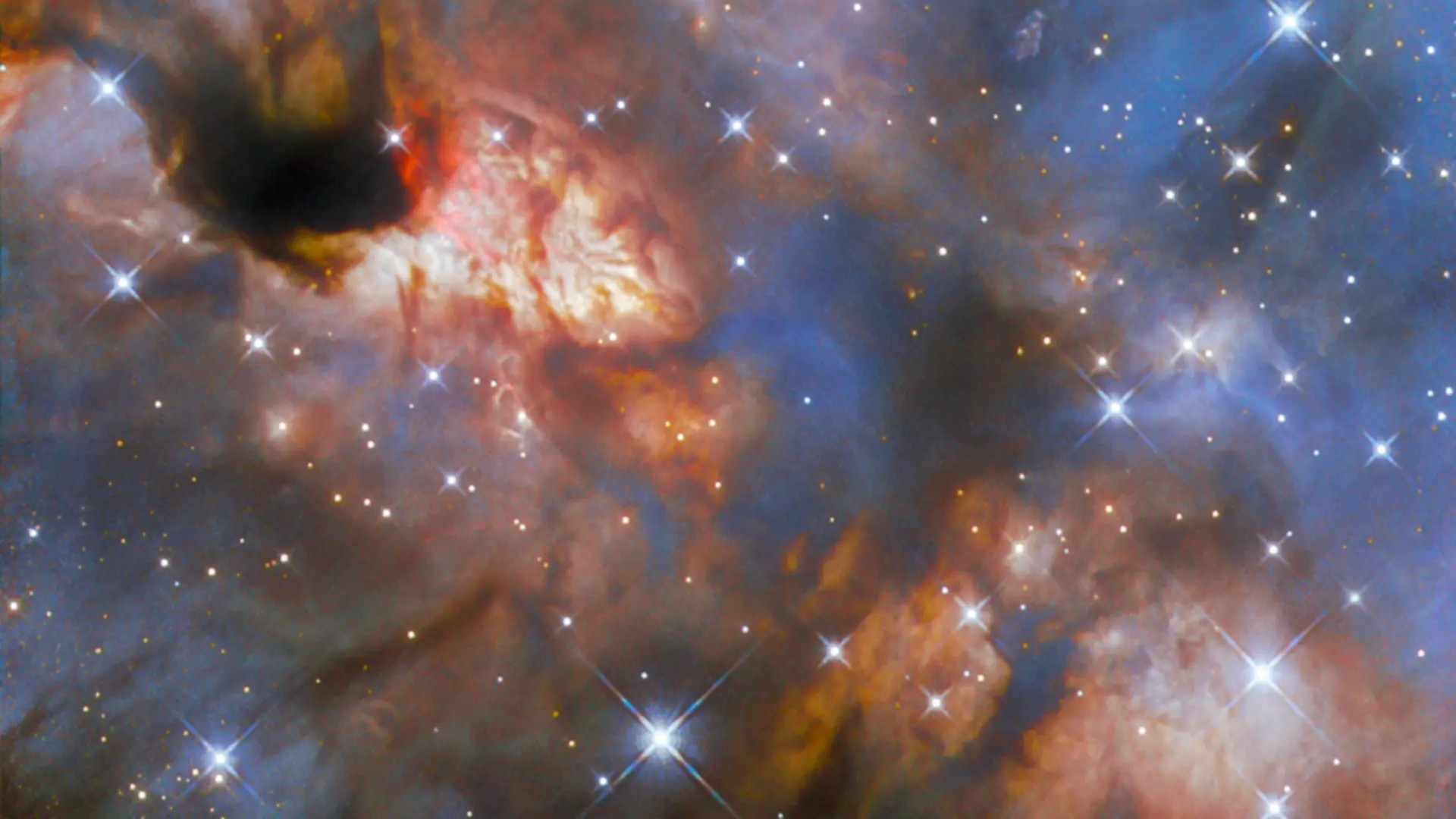 Molecular clouds, in the region known as IRAS 16562-3959. 