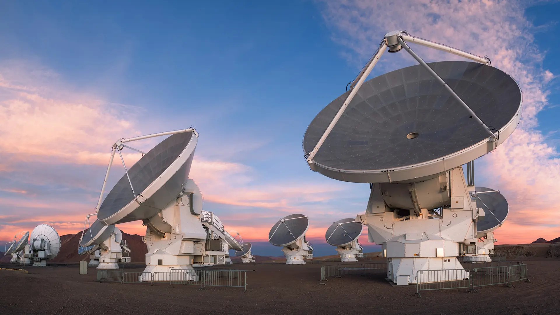 ALMA's telescope dishes under a blue sky