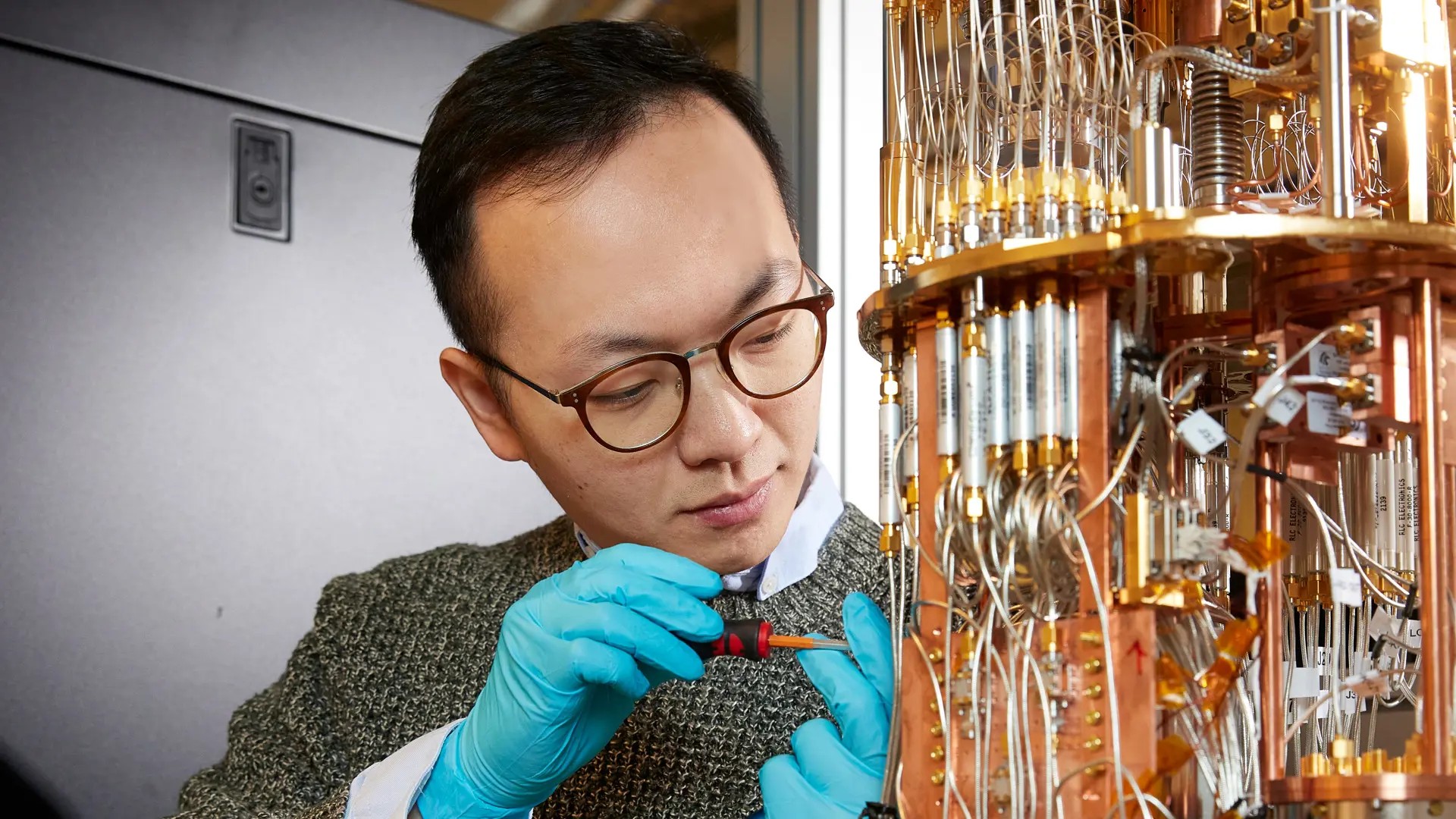 A person working at a quantum computer.